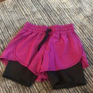 Purple lululemon shorts with built in biker shorts underneath